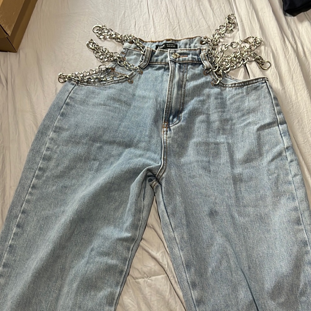 29 size blue medium jeans with chain sides.  Never worn.
